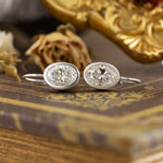 Load image into Gallery viewer, Matte Bezel Oval Cut Lab Diamond Dangle Earrings with Lab Blue Sapphire Hidden Halo
