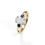 Lade Bild in die Galerieansicht, 2 CT Oval Cut Lab Diamond &amp; Blue Sapphire Three-Stone Engagement Ring - LGG Jewelry