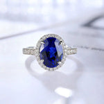 Lade Bild in die Galerieansicht, 2.5 Ct Oval Shape Lab Blue Sapphire Half Pave Halo Engagement Ring - LGG Jewelry
