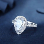 Load image into Gallery viewer, 3 Ct Pear Shape Lab Diamond Halo Half Pave Engagement Ring - LGG Jewelry
