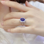 Lade Bild in die Galerieansicht, 4 Ct Oval Cut Lab Blue Sapphire Cluster Engagement Ring - LGG Jewelry
