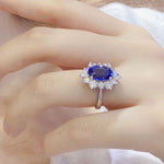Lade Bild in die Galerieansicht, 4 Ct Oval Cut Lab Blue Sapphire Cluster Engagement Ring - LGG Jewelry