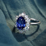 Lade Bild in die Galerieansicht, 4 Ct Oval Cut Lab Blue Sapphire Cluster Engagement Ring - LGG Jewelry