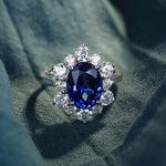 Load image into Gallery viewer, 4 Ct Oval Cut Lab Blue Sapphire Cluster Engagement Ring - LGG Jewelry
