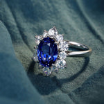 Load image into Gallery viewer, 4 Ct Oval Cut Lab Blue Sapphire Cluster Engagement Ring - LGG Jewelry
