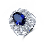 Load image into Gallery viewer, 6 Ct Oval Cut Lab Blue Sapphire Cluster Engagement Ring - LGG Jewelry
