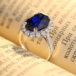 Lade Bild in die Galerieansicht, 8.5 Ct Oval Cut Lab Blue Sapphire Halo Engagement Ring - LGG Jewelry