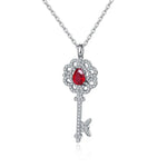 Load image into Gallery viewer, Pear Cut Lab Ruby Pave Key Pendant Necklace - LGG Jewelry
