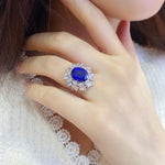 Lade Bild in die Galerieansicht, Luxury 5 Ct Oval Lab Blue Sapphire Cluster Engagement Ring - LGG Jewelry