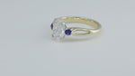 Load and play video in Gallery viewer, 2 CT Oval Cut Lab Diamond &amp; Blue Sapphire Three-Stone Engagement Ring
