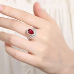 Lade Bild in die Galerieansicht, Split Shank Crown 2.7 Ct Pear Lab Ruby Half Pave Halo Engagement Ring - LGG Jewelry