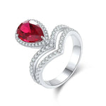 Lade Bild in die Galerieansicht, Split Shank Crown 2.7 Ct Pear Lab Ruby Half Pave Halo Engagement Ring - LGG Jewelry