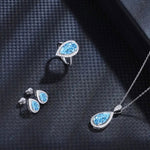Lade Bild in die Galerieansicht, Tear of Ocean 5 Ct Pear Cut Lab Paraiba Halo Engagement Ring - LGG Jewelry
